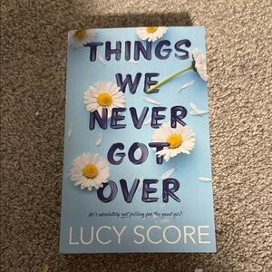 Things We Never Got Over by Lucy Score - Light Blue with White Daisies